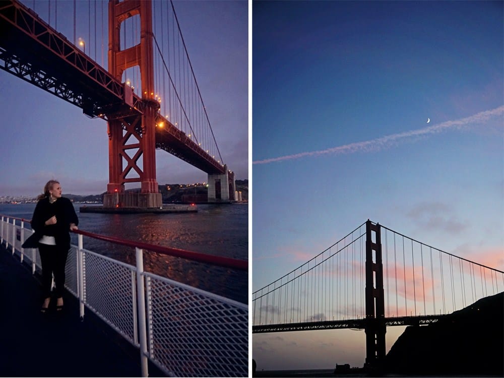 sailing under golden gate bridge at sunset