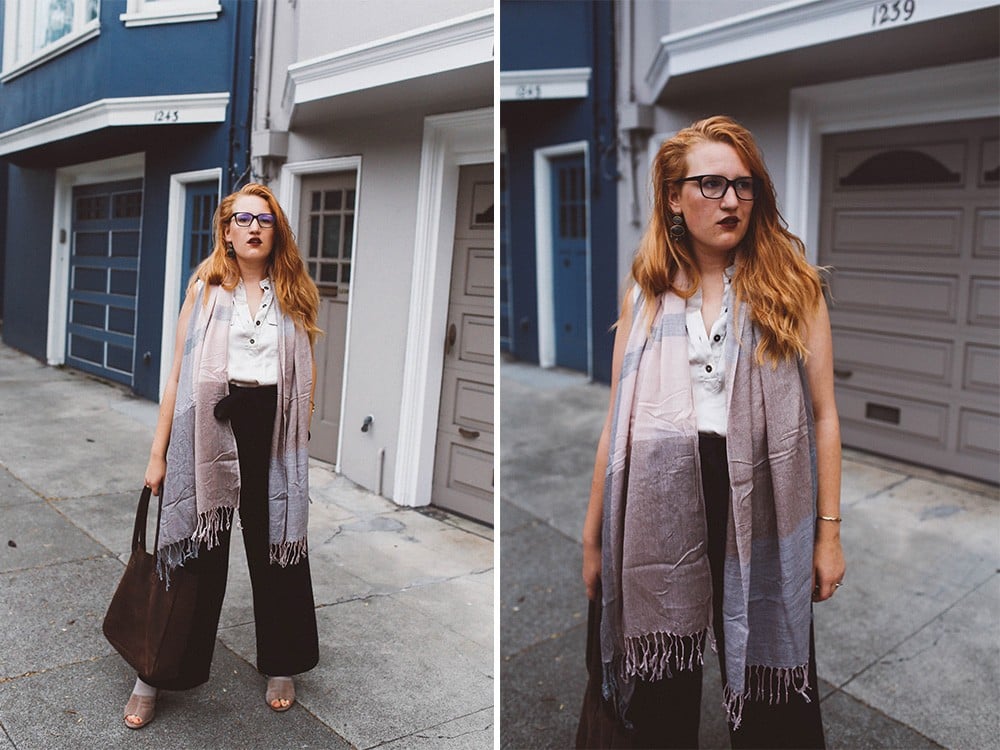 pink scarf black wide leg pants woman red hair