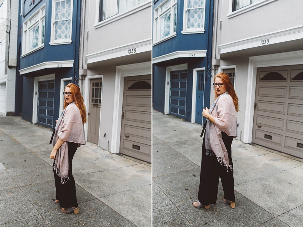 pink scarf black wide leg pants woman red hair