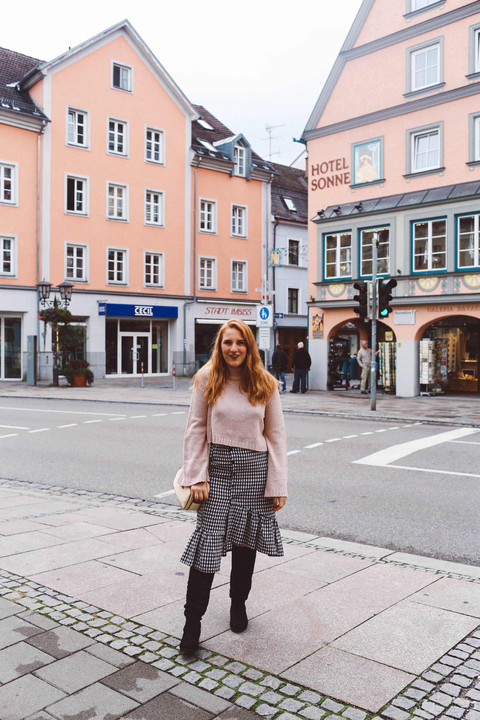 Füssen, Germany pink sweater gingham skirt boots