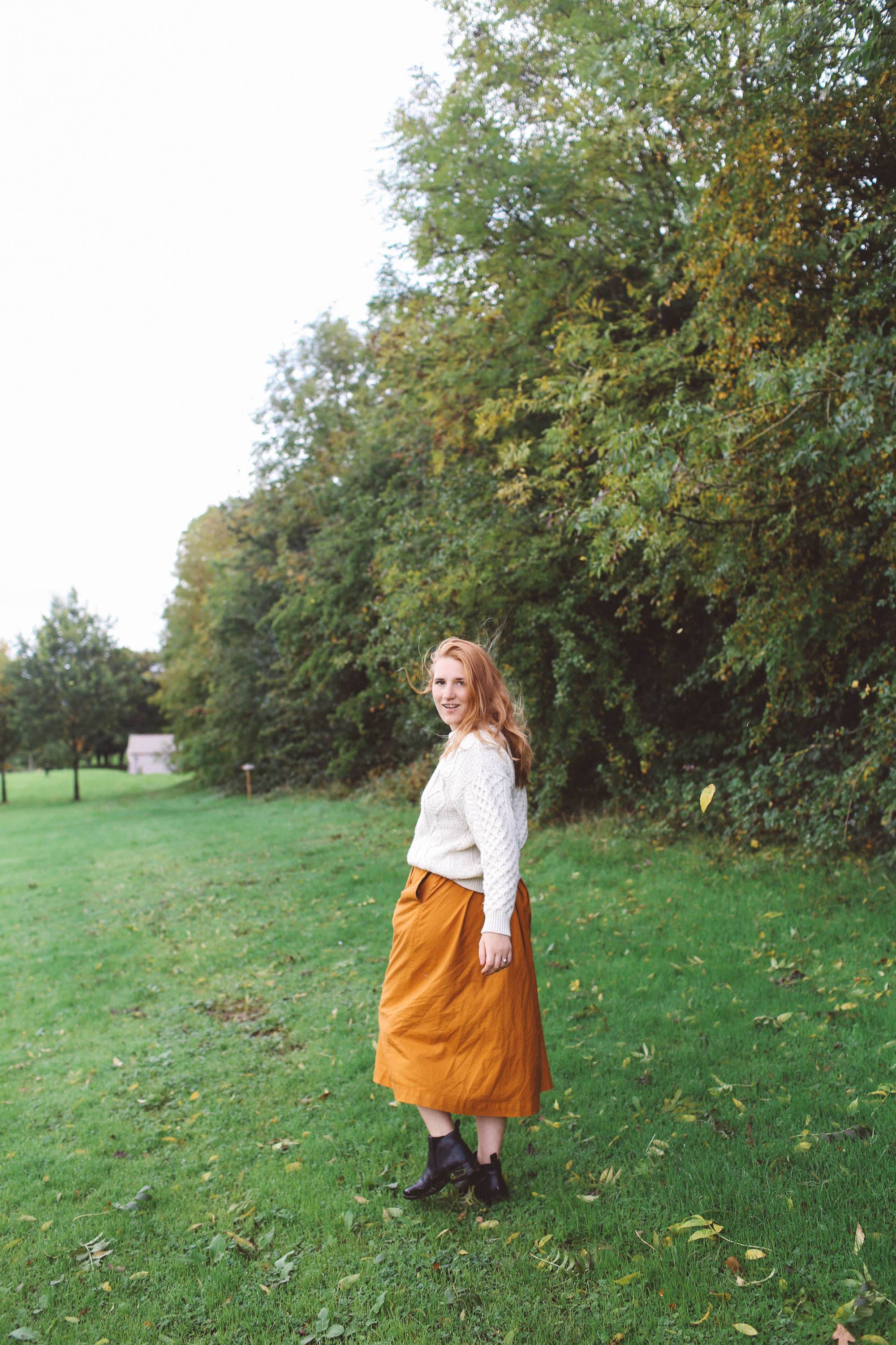 Lyrath Estate orange skirt white sweater