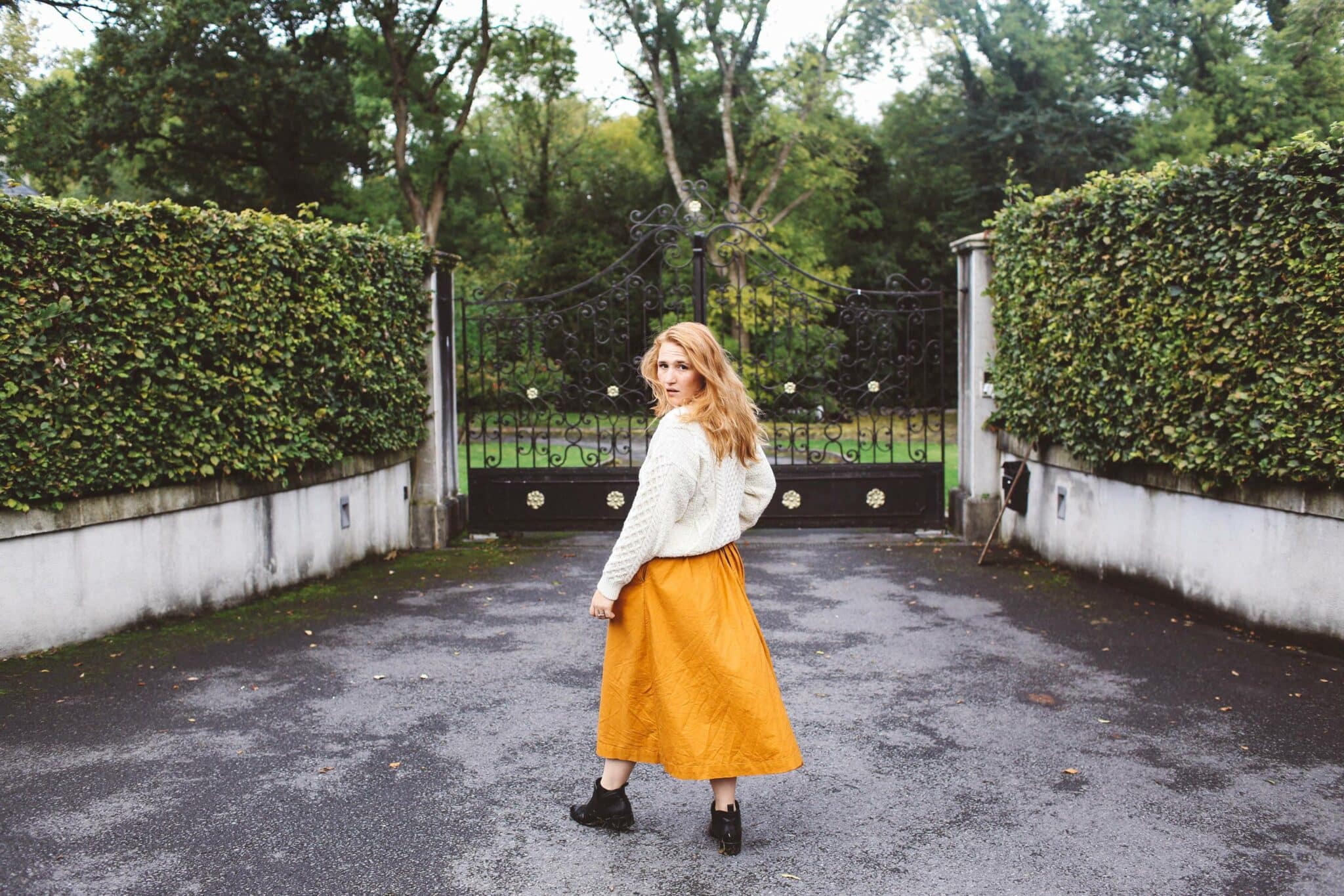 Lyrath Estate orange skirt white sweater