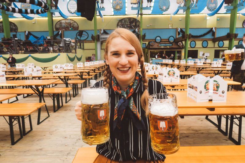 Oktoberfest Munich woman holding beer spaten