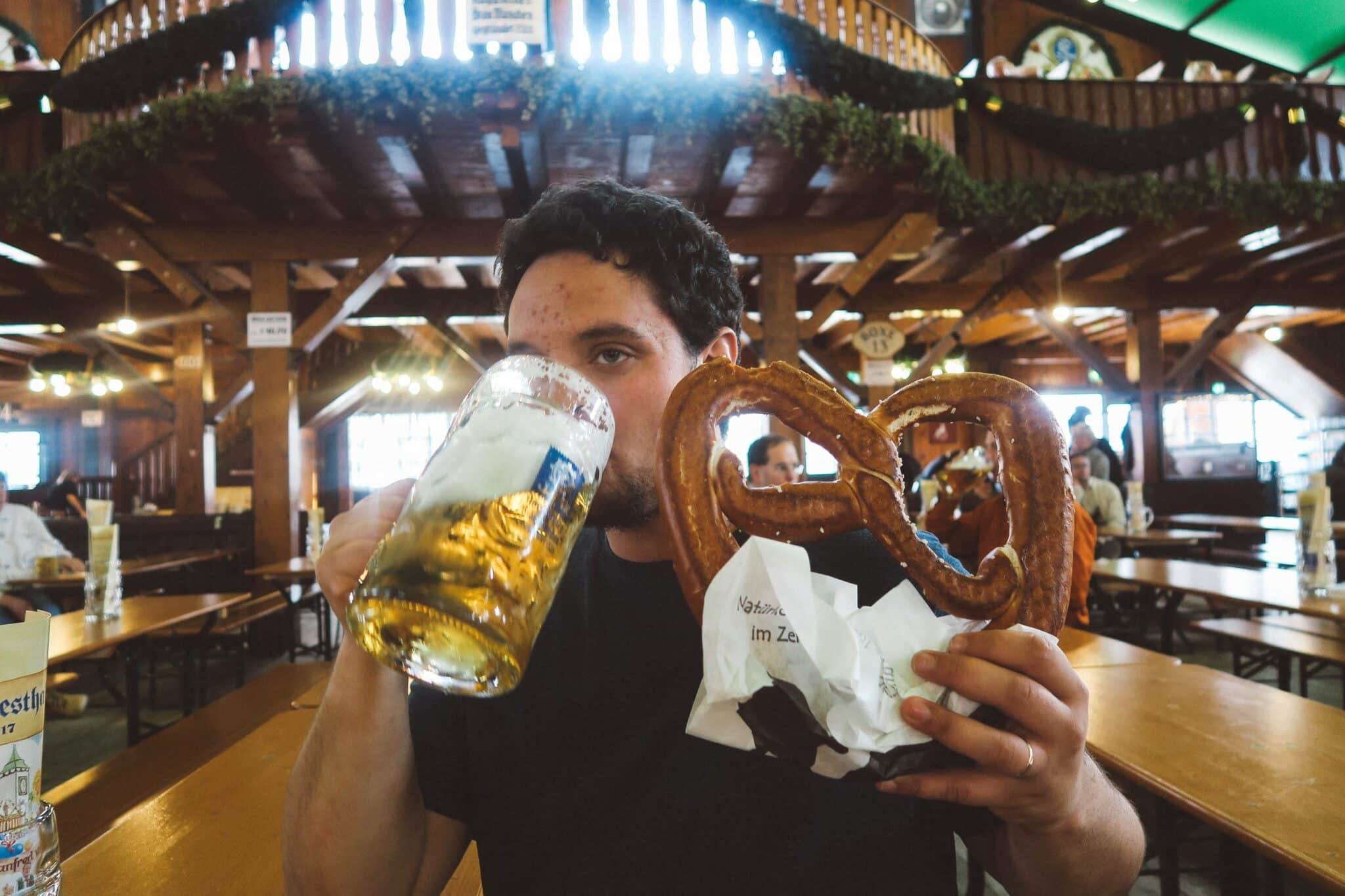 Oktoberfest Munich augustiner man holding pretzel