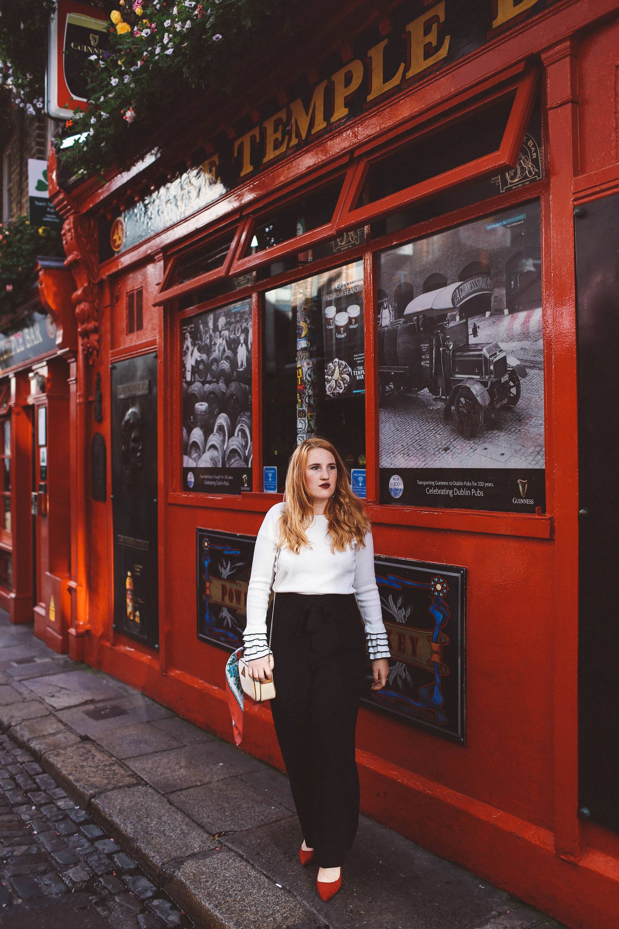 temple bar woman white sweater black pants