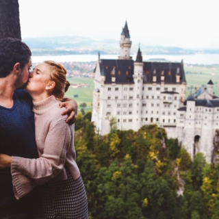 Neuschwanstein Castle couple kissing honeymoon