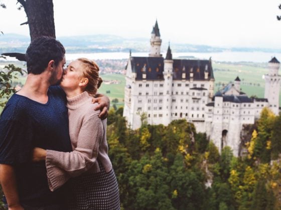 Neuschwanstein Castle couple kissing honeymoon