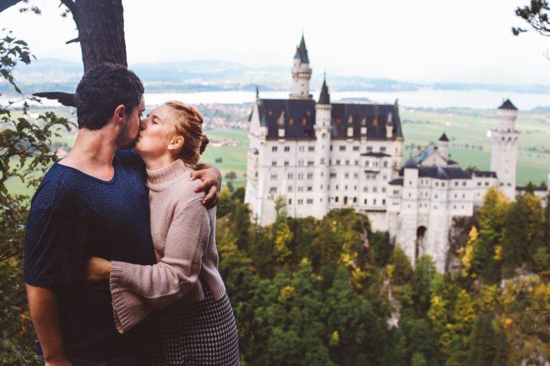 Neuschwanstein Castle couple kissing honeymoon
