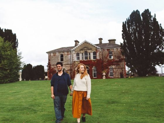 couple holding hands ireland orange skirt