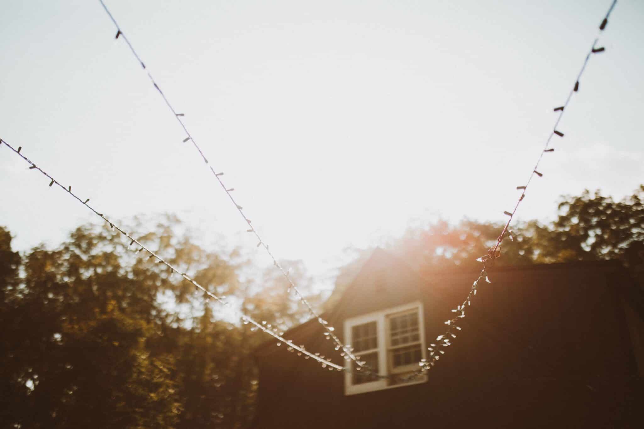 wedding string lights golden hour house