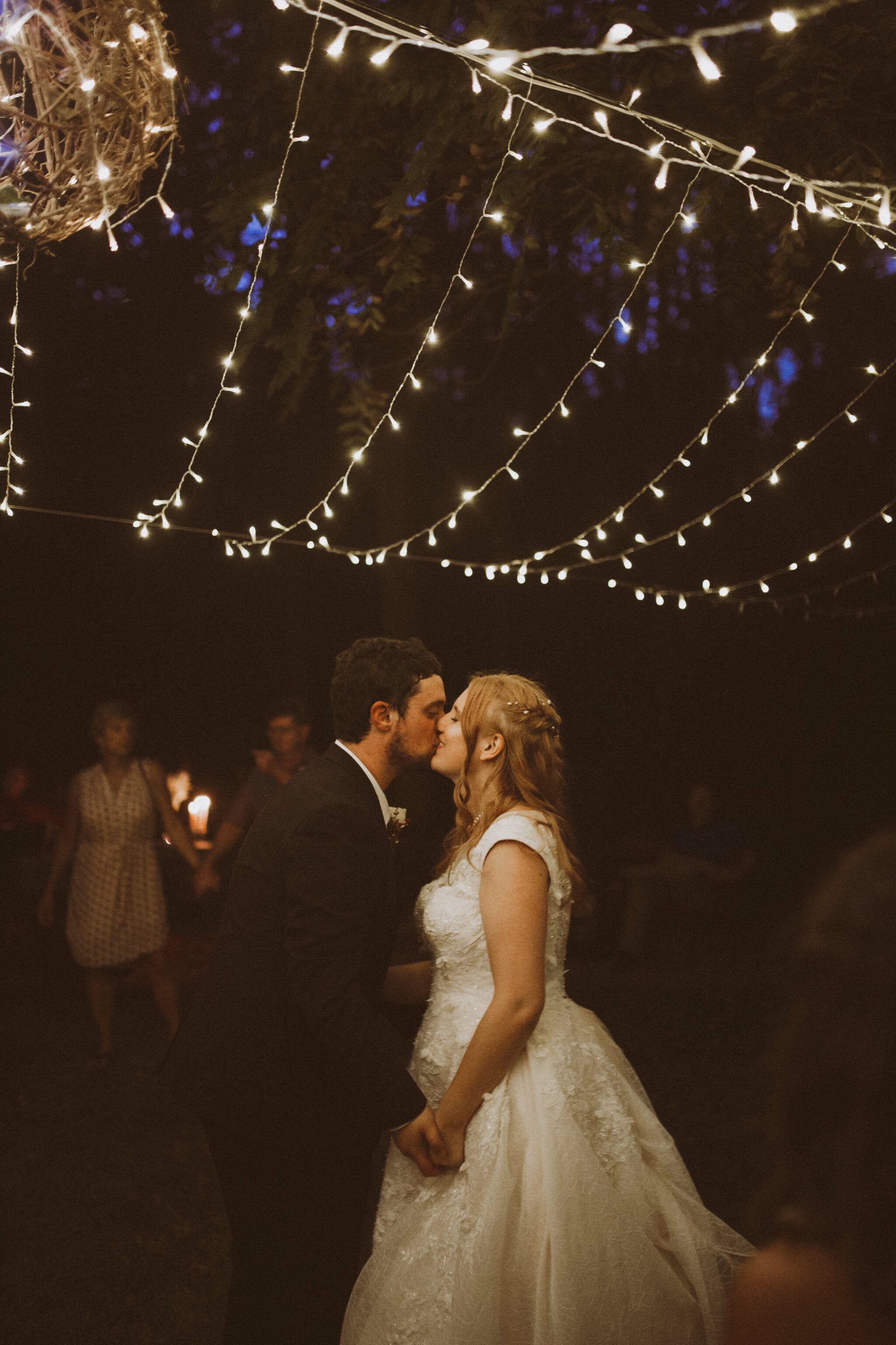 bride groom first dance outdoor string lights