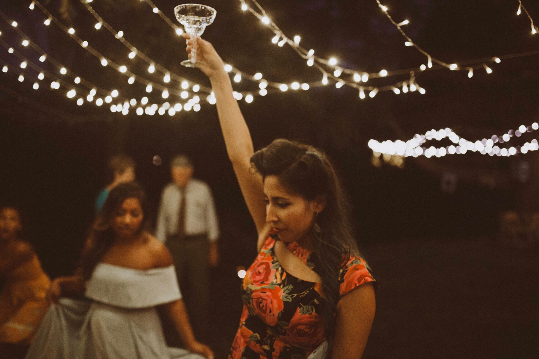 wedding dancing holding drink up