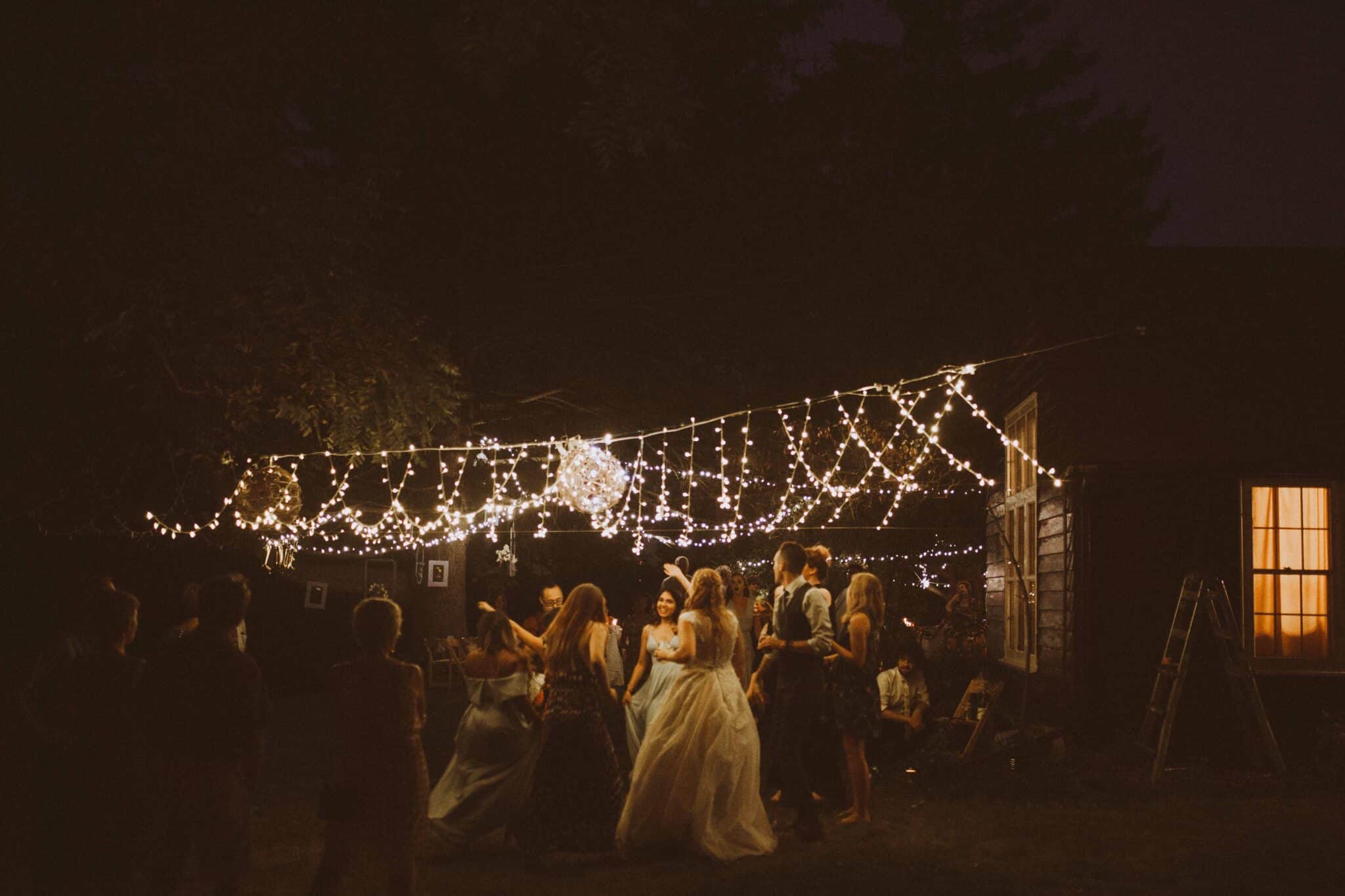 wedding dance floor string lights woods outdoor