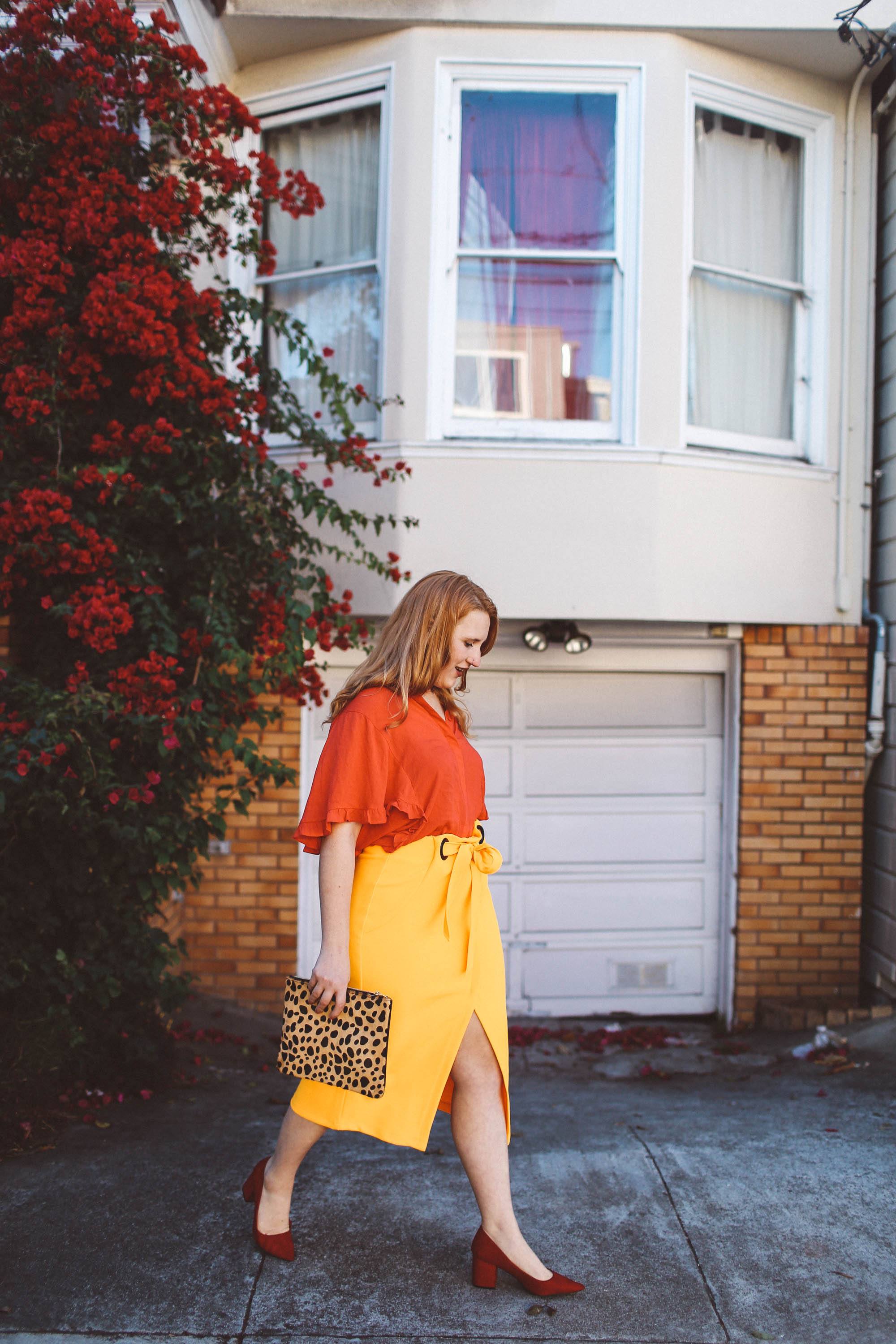 yellow wrap skirt red blouse leopard purse