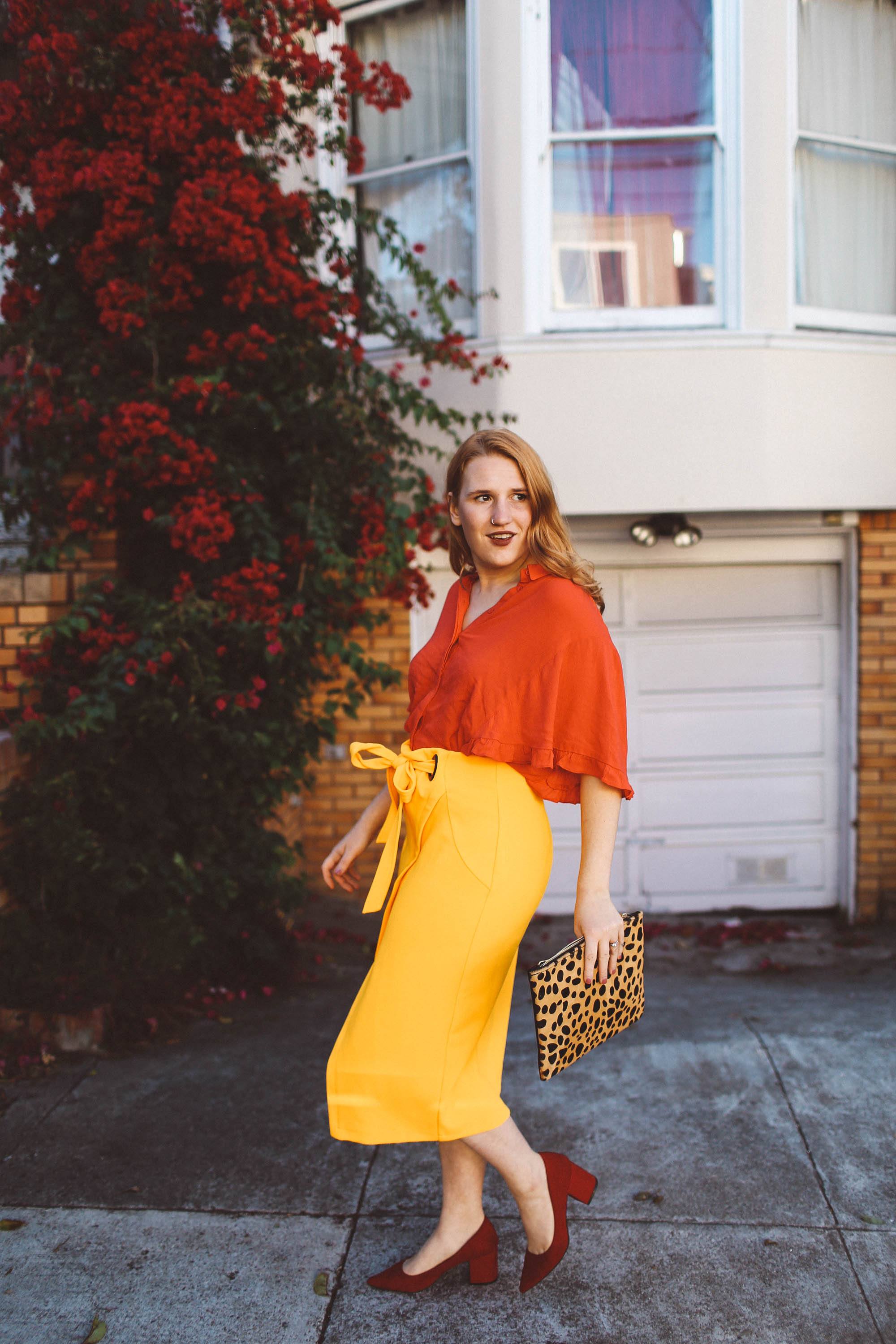 yellow wrap skirt red blouse leopard purse
