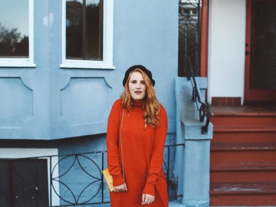 red sweater dress beret yellow purse combat boots