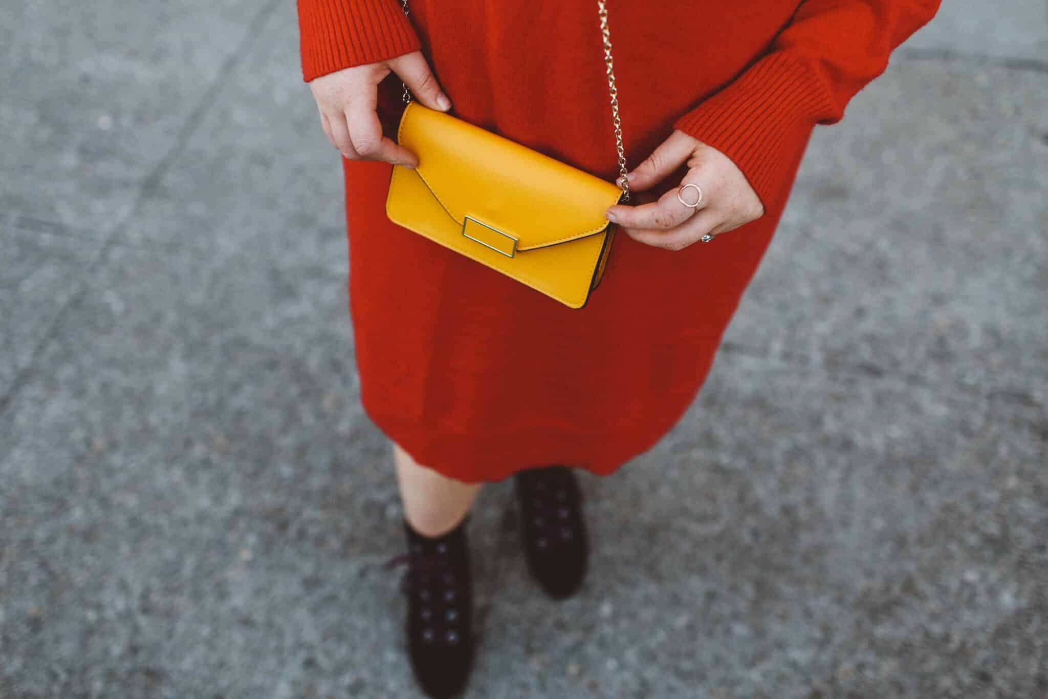 red sweater dress beret yellow purse combat boots