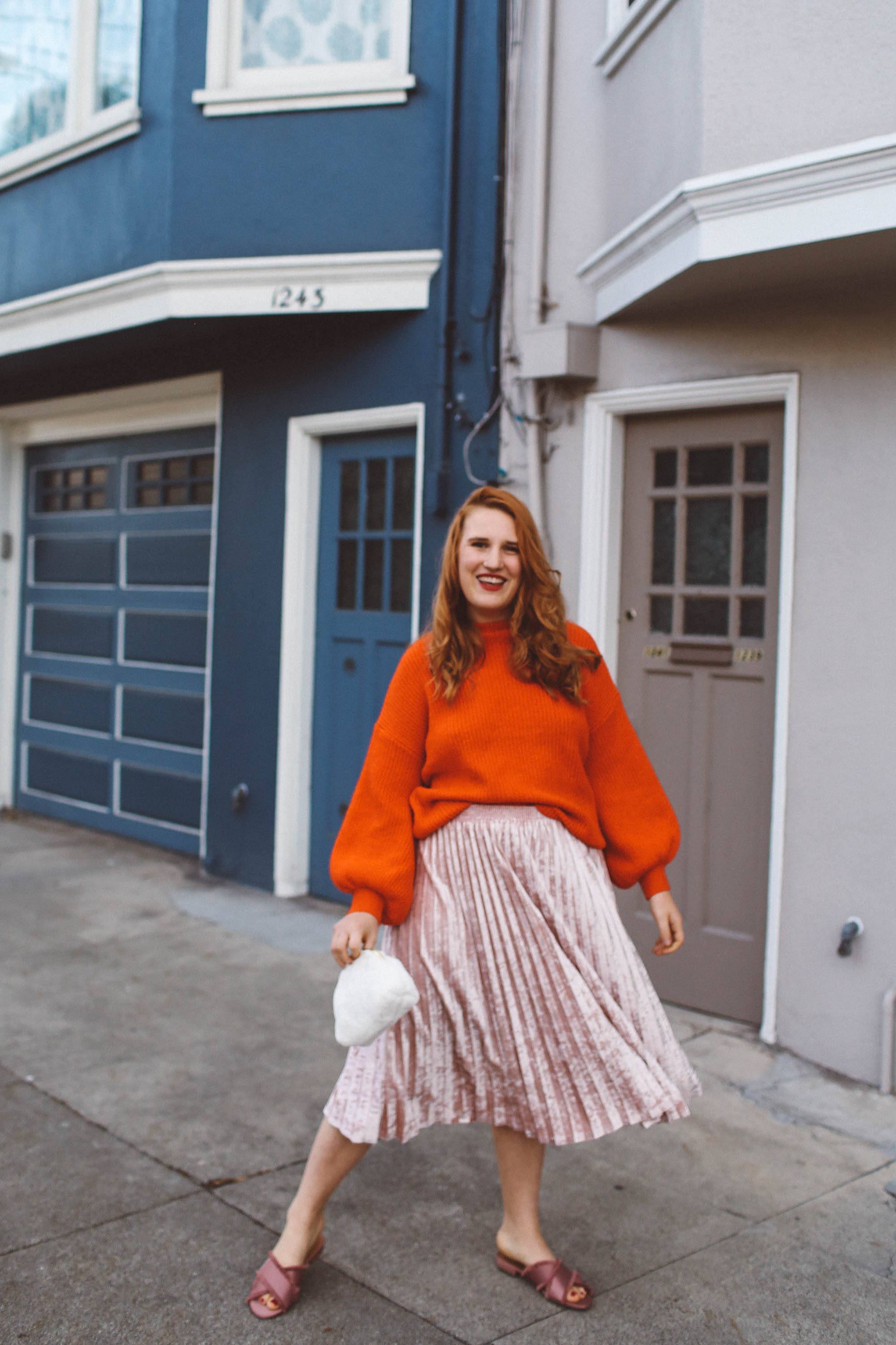 red sweater pink skirt woman white purse pink flats