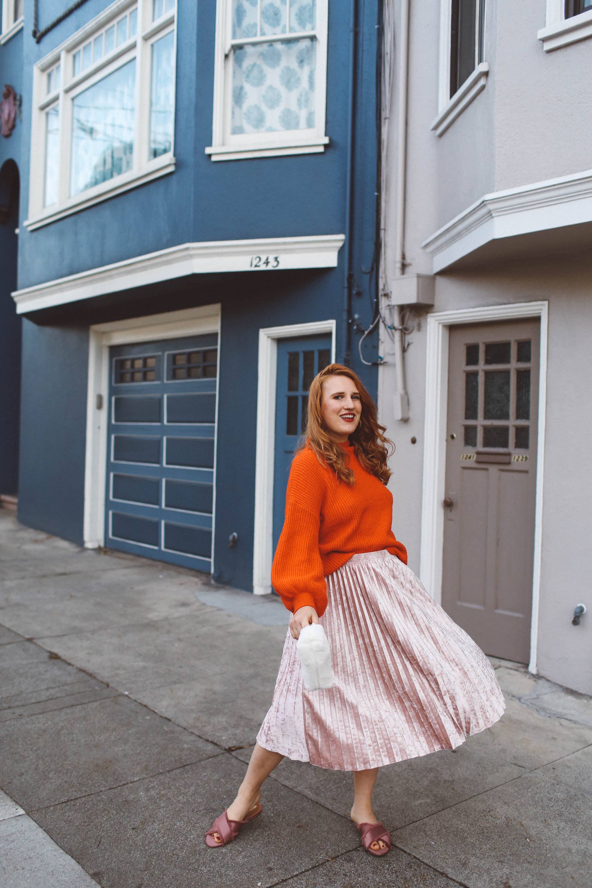 red sweater pink skirt woman white purse pink flats