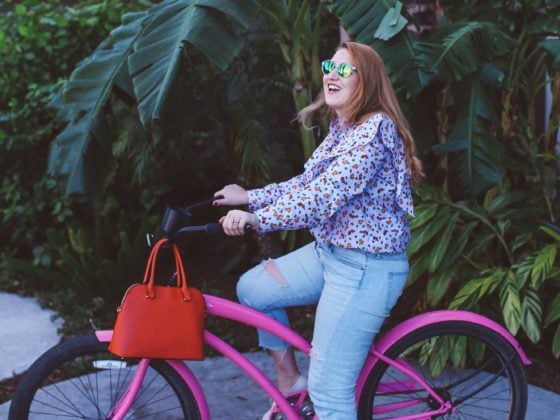 purple ruffle top pink bike palm trees