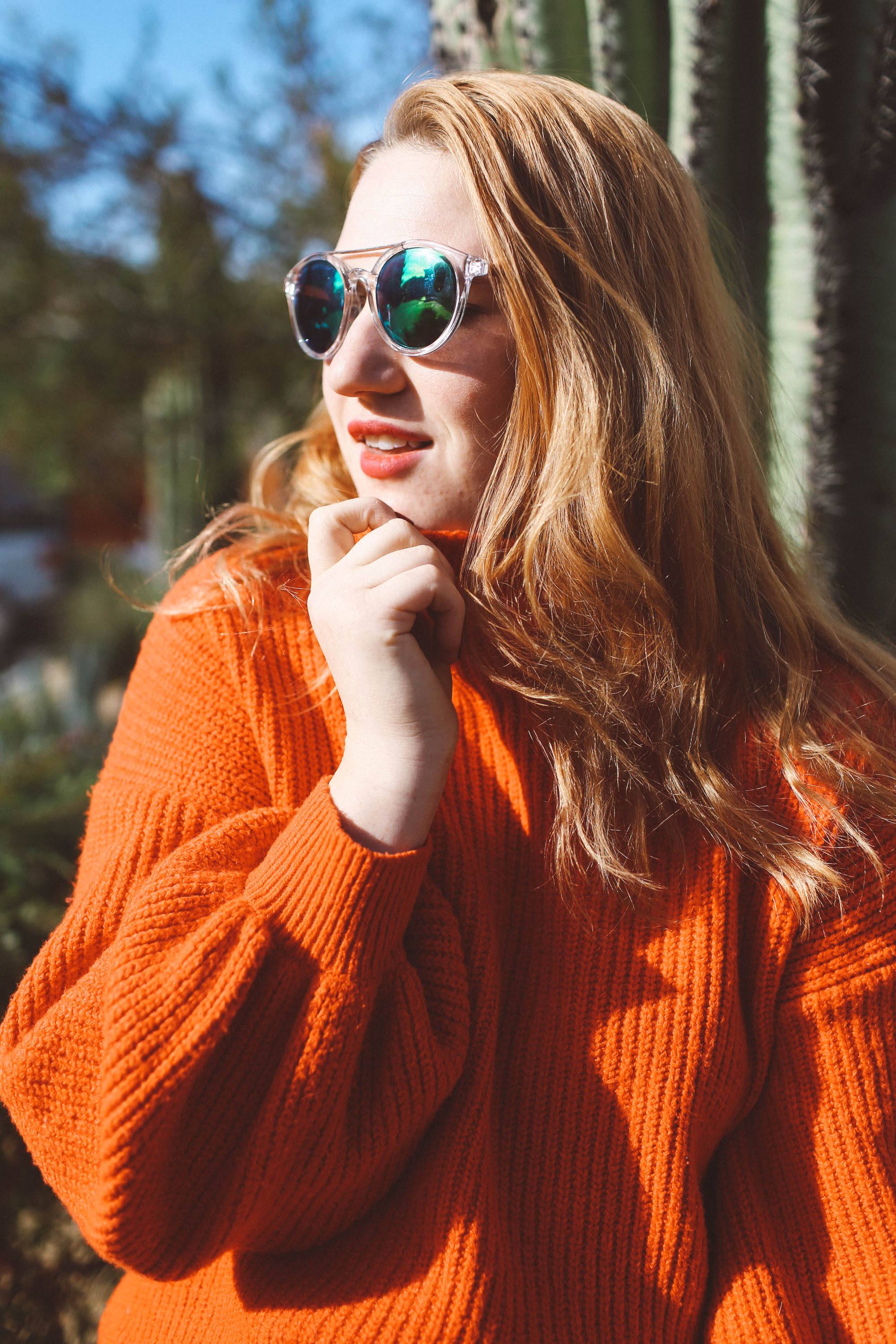 red sweater sunglasses