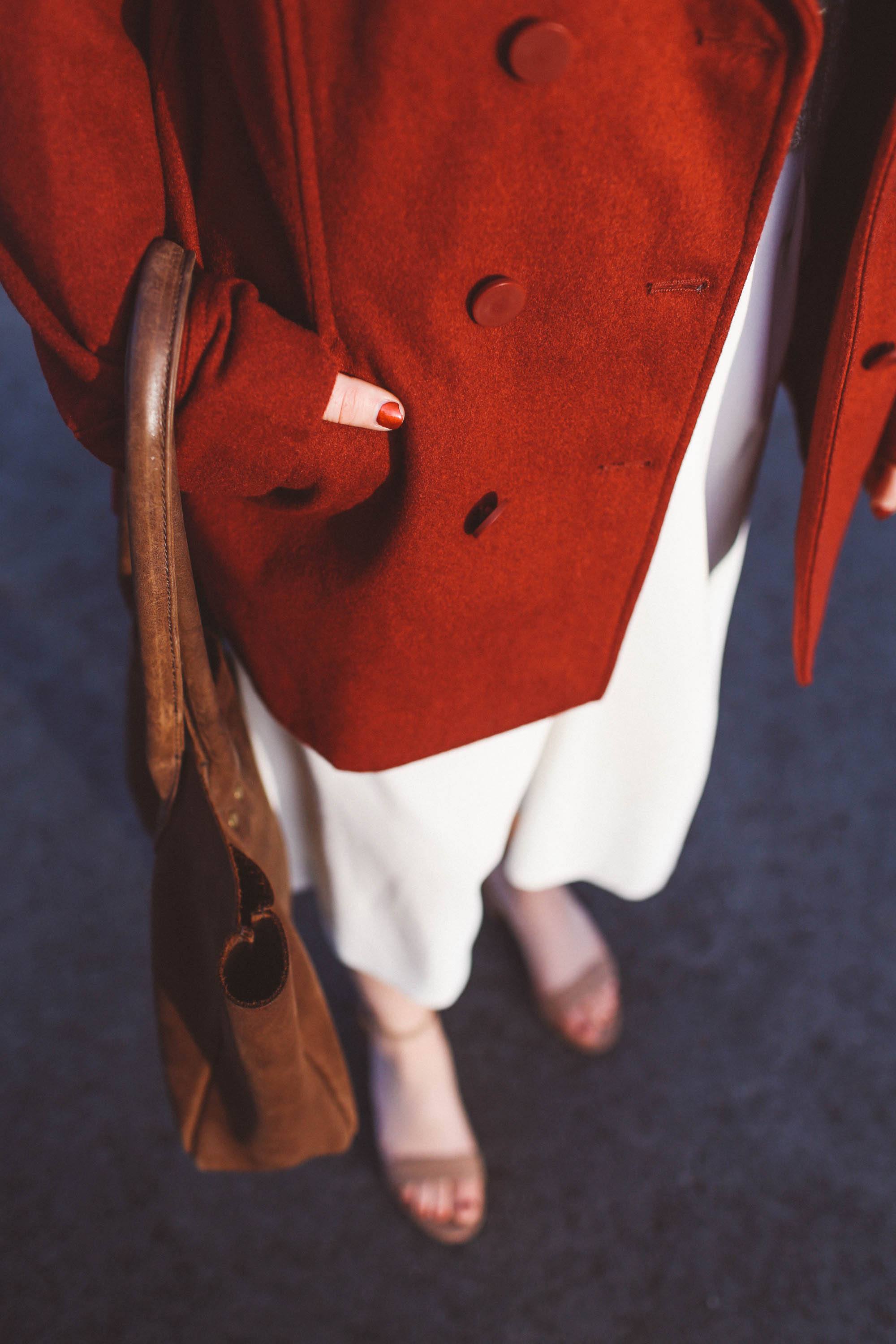 red coat brown purse