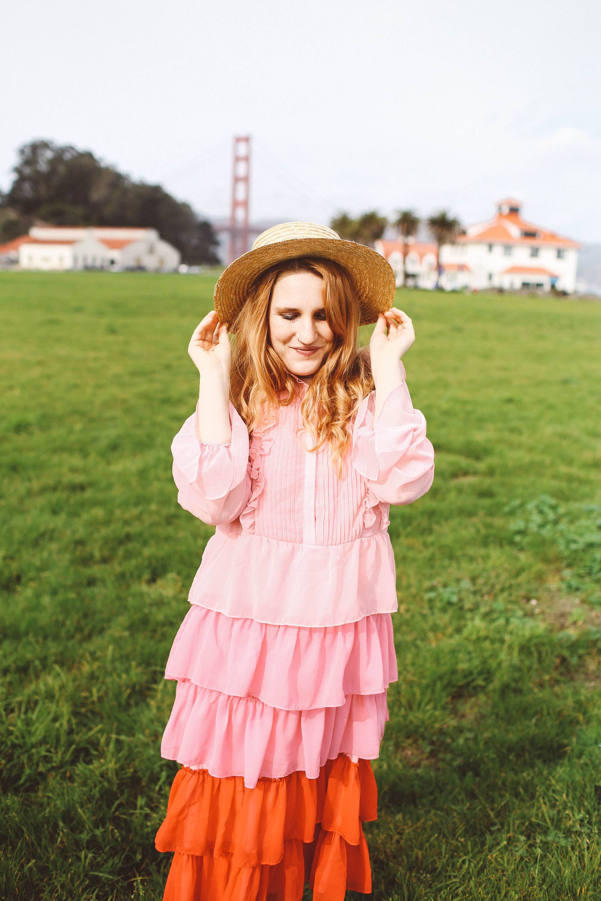 pink ruffle dress san francisco golden gate bridge straw hat