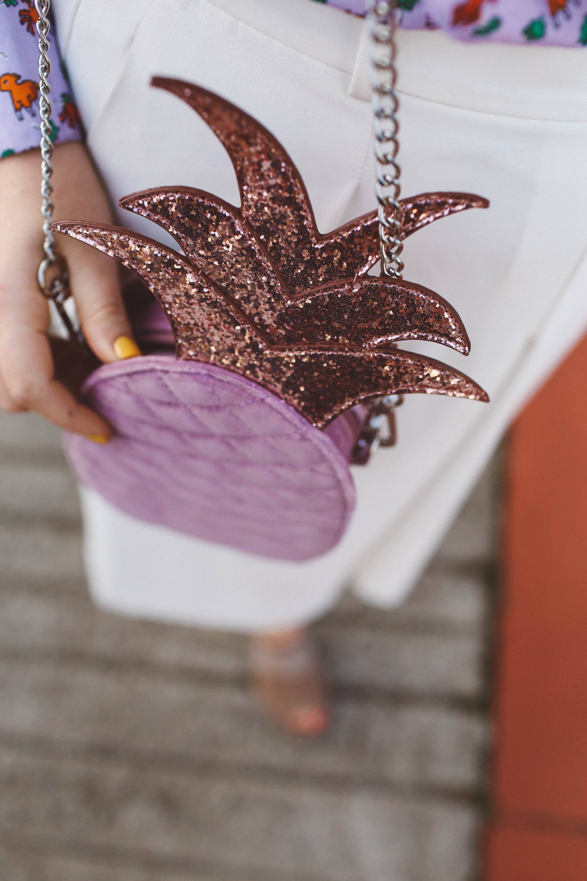 pineapple purse, purple ruffle shirt, pink house