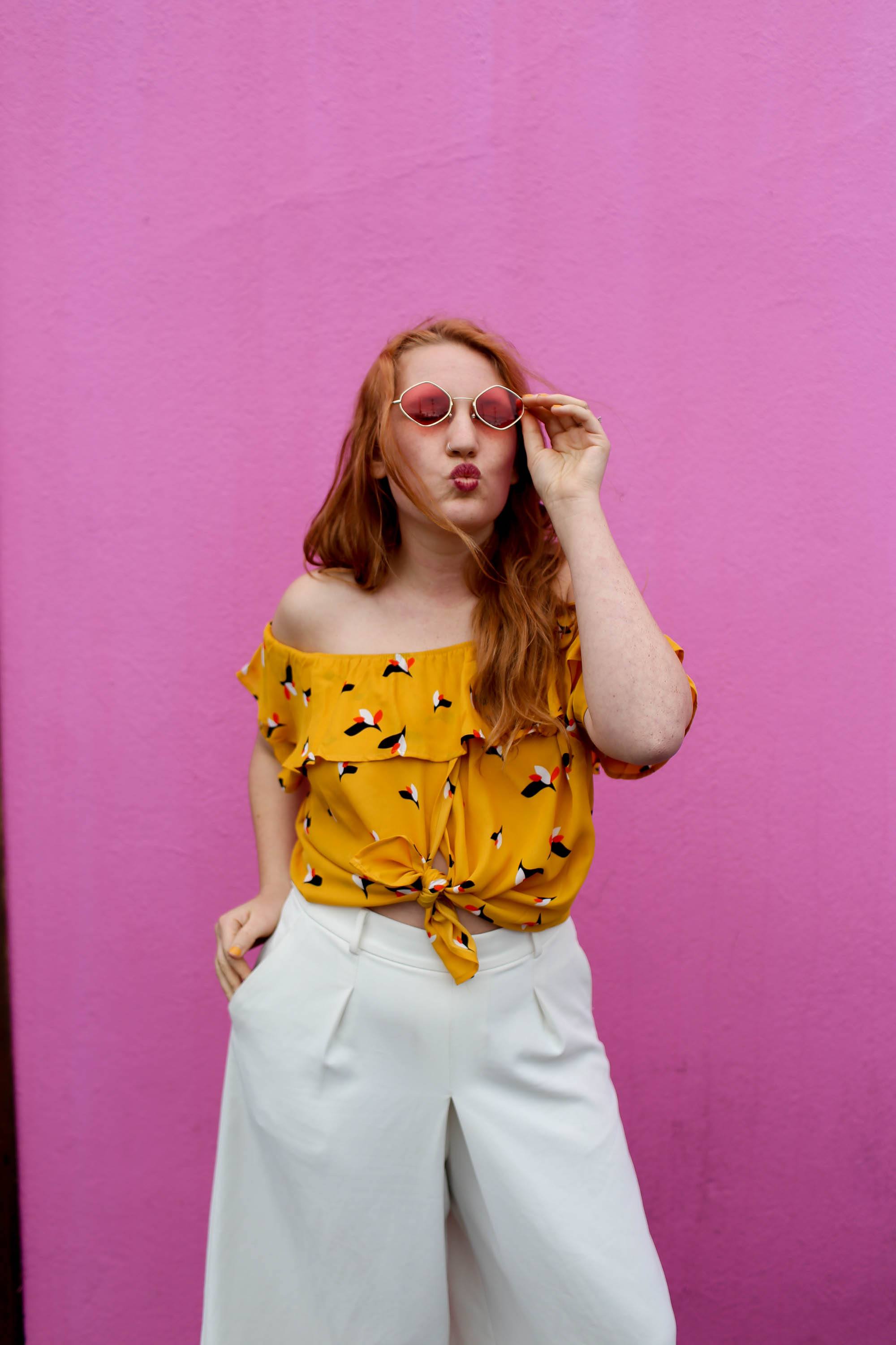 Woman in front of the pink wall in Los Angeles