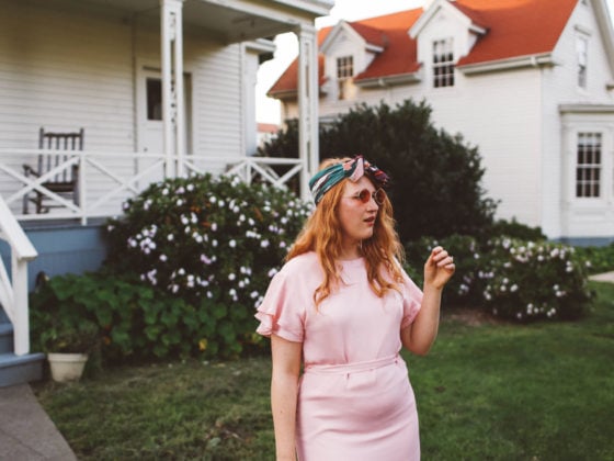 woman wearing headscarf, pink dress, pink sunglasses in San Francisco Presidio