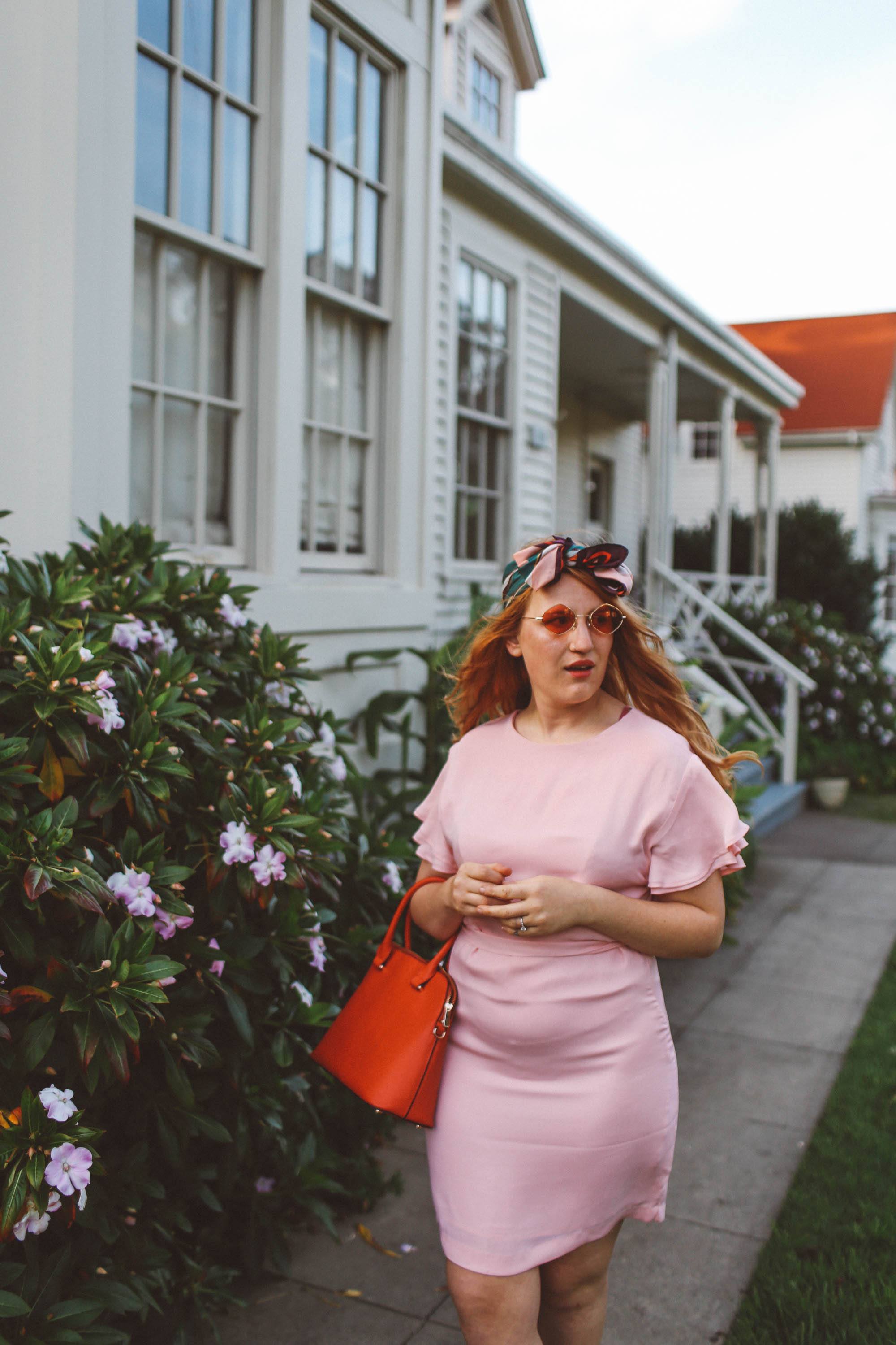 woman wearing headscarf, pink dress, pink sunglasses in San Francisco Presidio