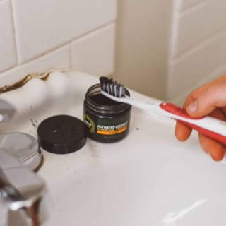 activated charcoal teeth whitening on a toothbrush