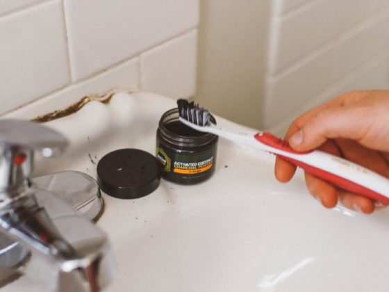 activated charcoal teeth whitening on a toothbrush