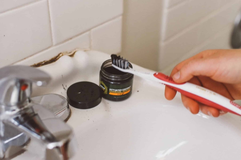 activated charcoal teeth whitening on a toothbrush