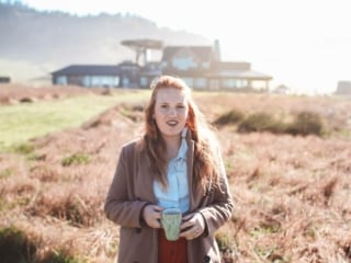 Woman drinking coffee at Newport Ranch in Mendocino