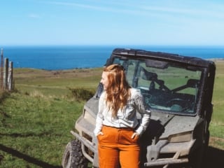 Woman in front of an ATV at Newport Ranch in Mendocino