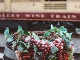 Grapes on a barrel on the Napa Valley Wine Train Platform