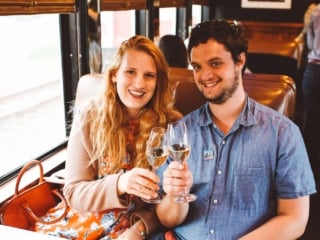 Man and woman clinking Wine Glasses on the Napa Valley Wine Train