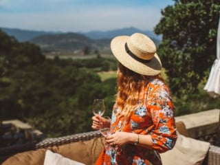 Woman in a floral dress at napa valley winery