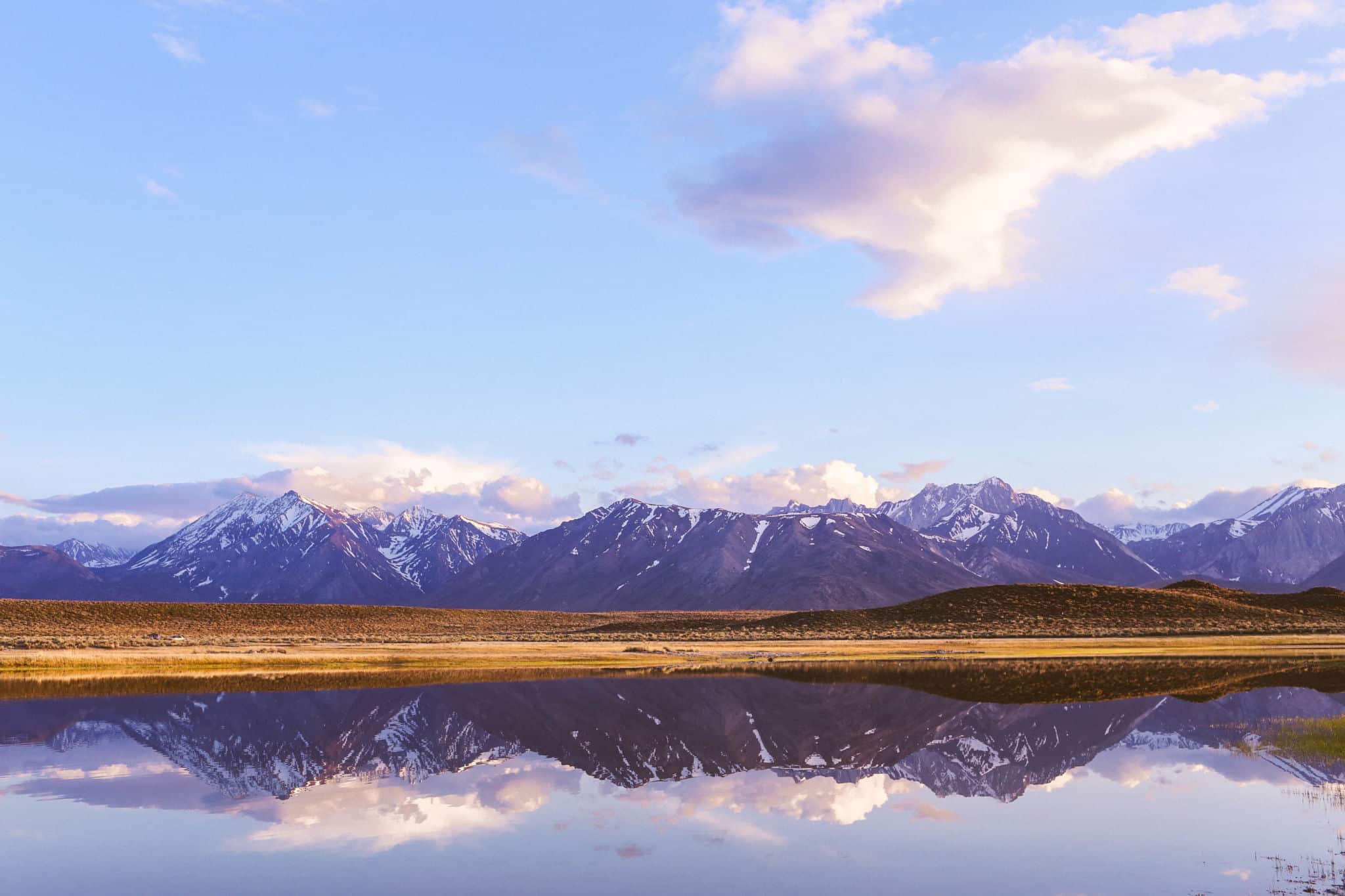 pond and mountains reflecting in the water