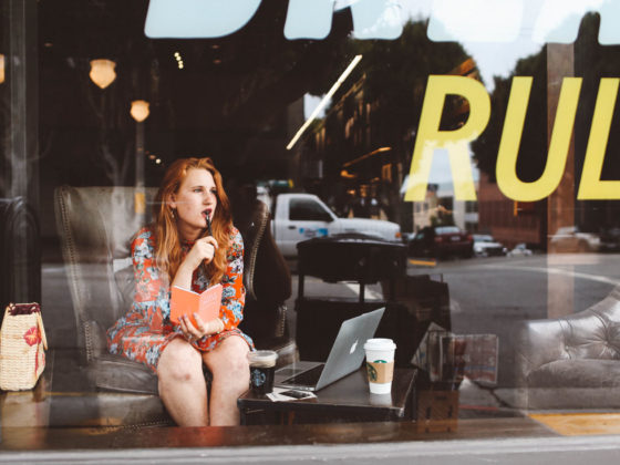 Woman in comfy chair working in starbucks