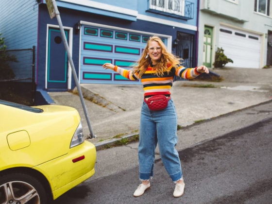 Woman wearing red fanny pack