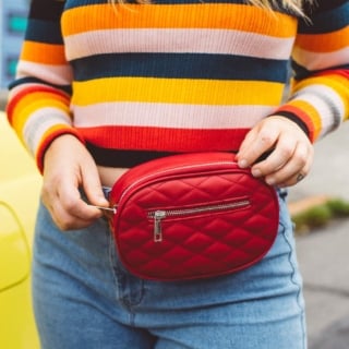 Woman wearing red fanny pack