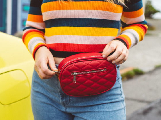 Woman wearing red fanny pack