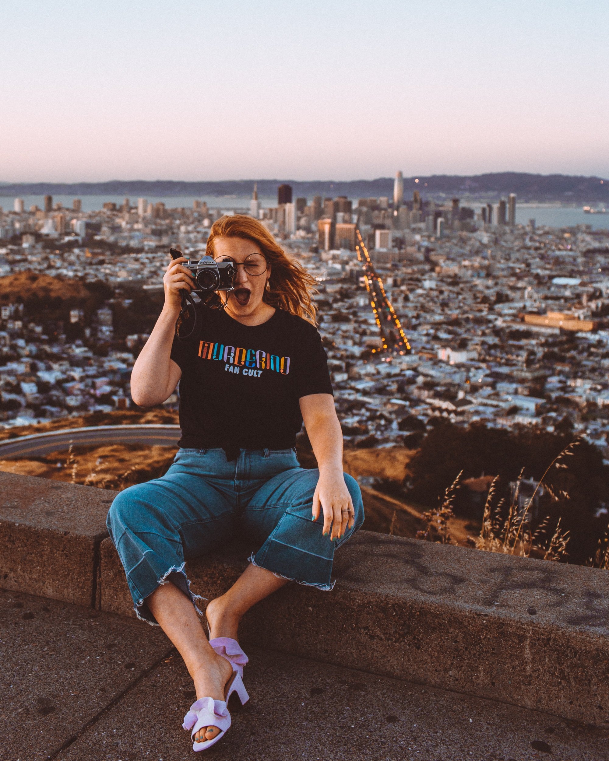 Woman On a peak overlooking San Francisco