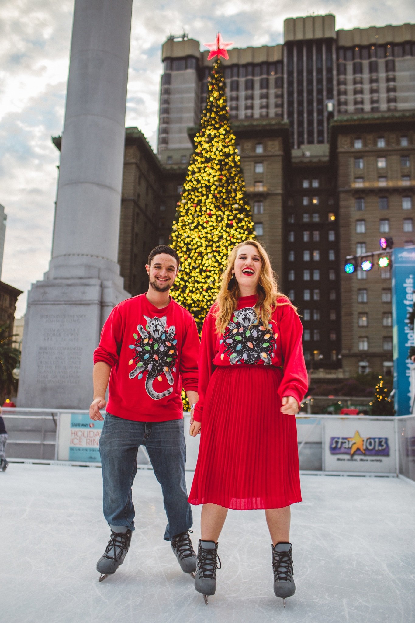union square ice skate ugly Christmas sweater couple skating