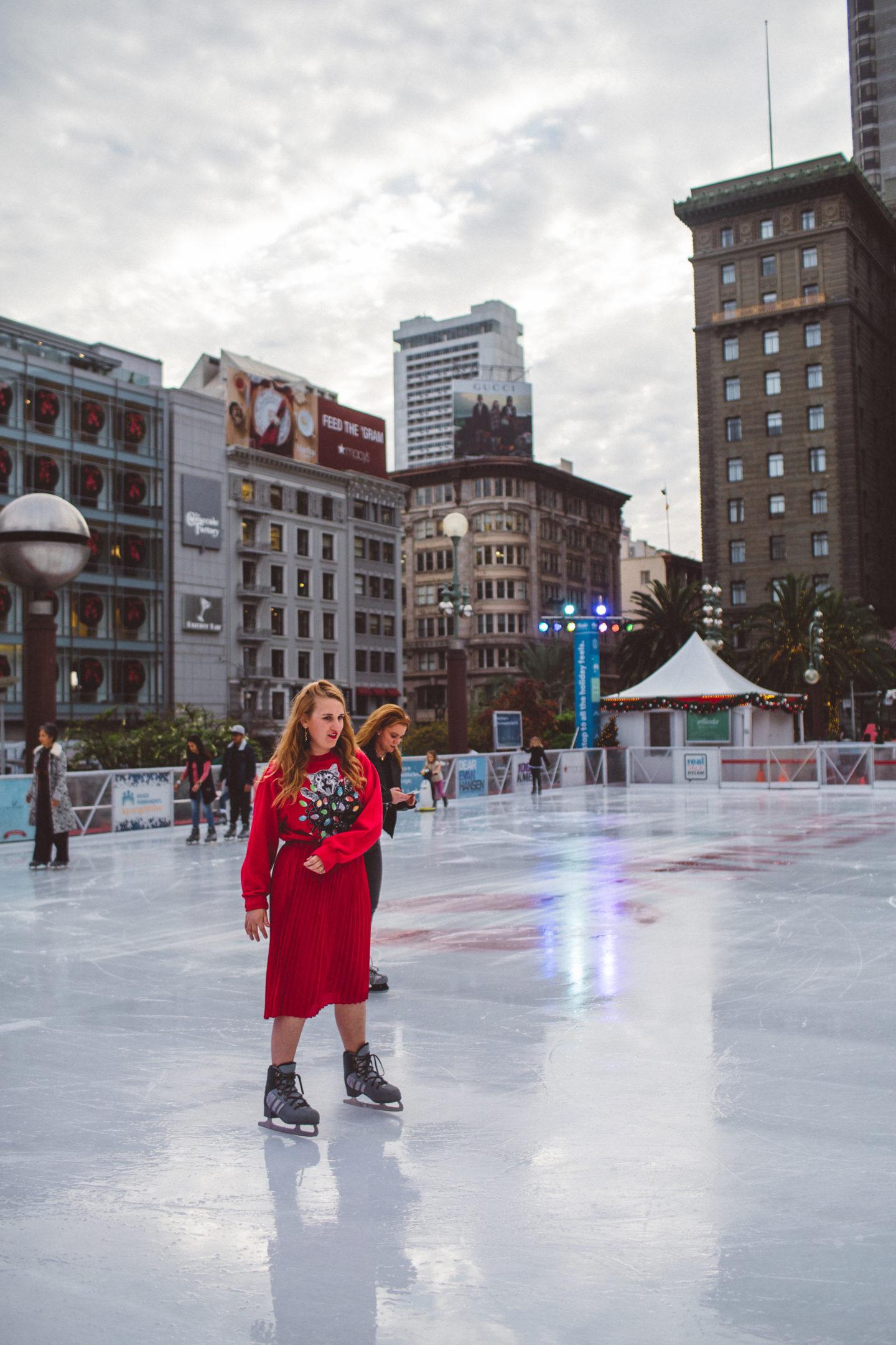 union square ice skate ugly Christmas sweater girl skating