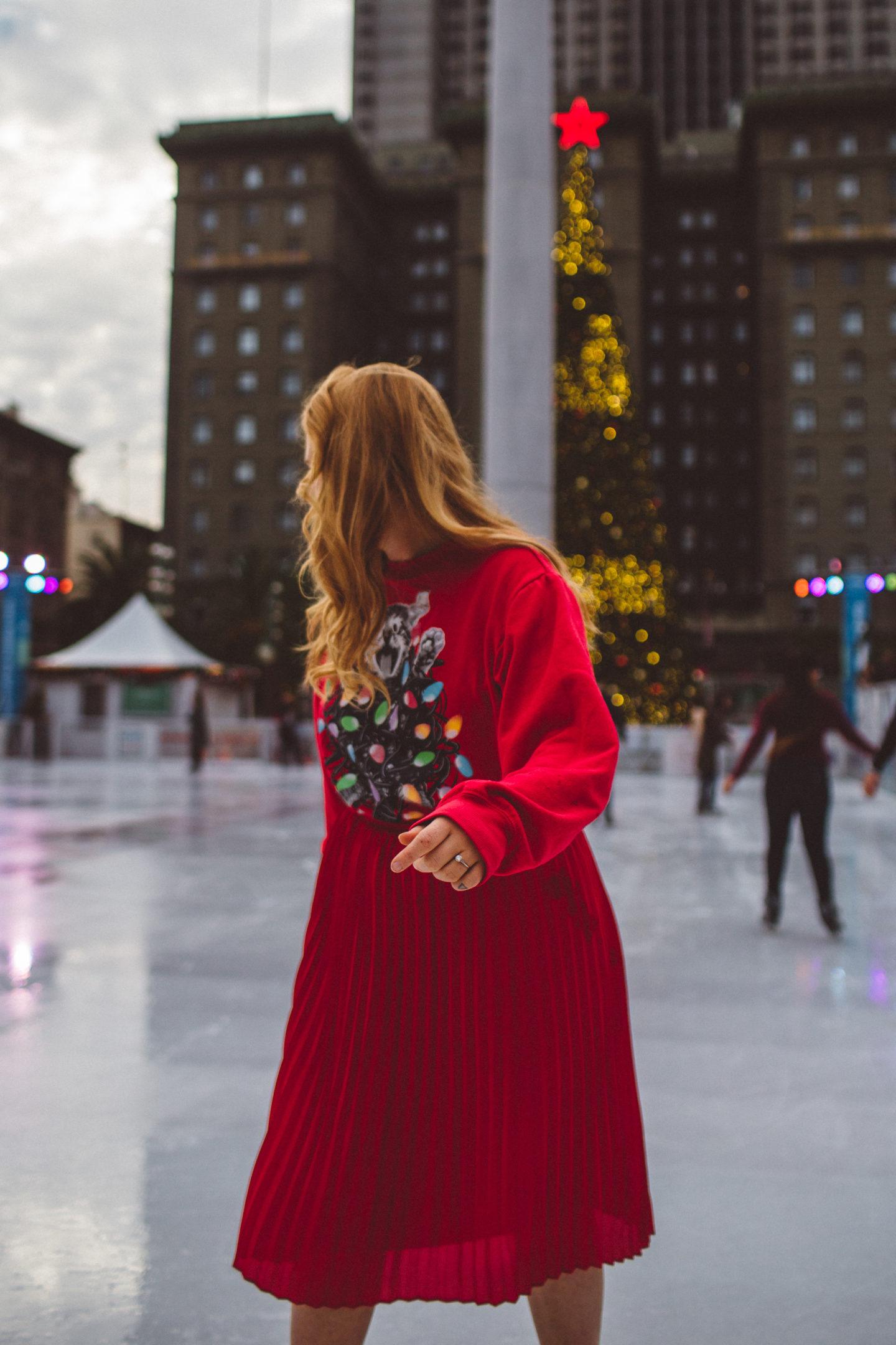 union square ice skate ugly Christmas sweater girl skating