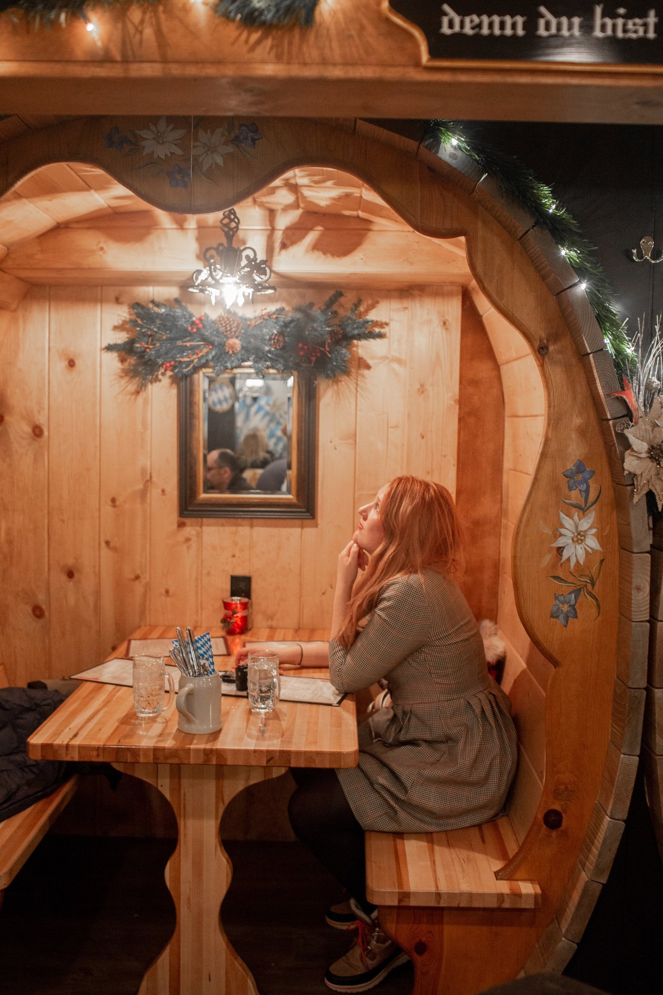 woman sitting in barrel booth