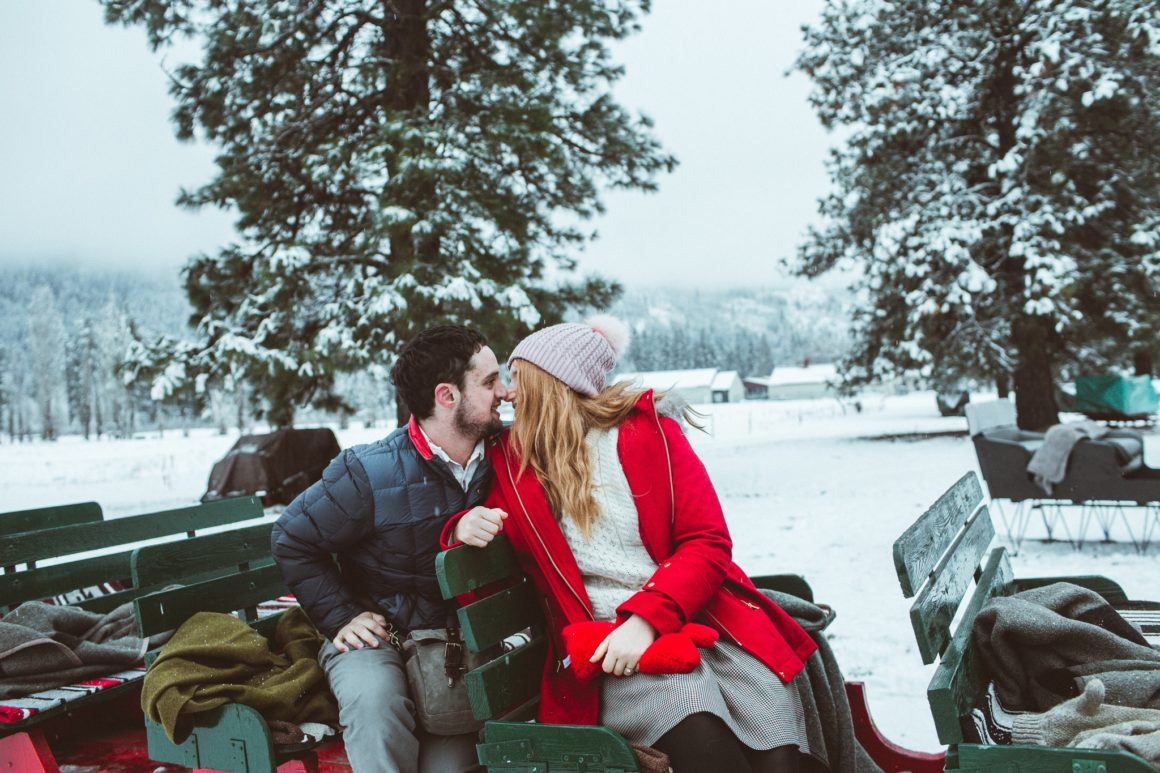 man and woman on a sleigh